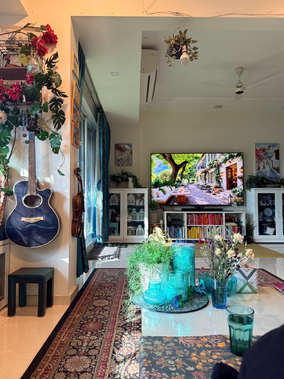 Quiet reading nook with guitar, books, and warm light